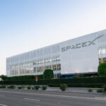 Exterior view of spacex headquarters in hawthorne california showcasing the companys building and a rocket display