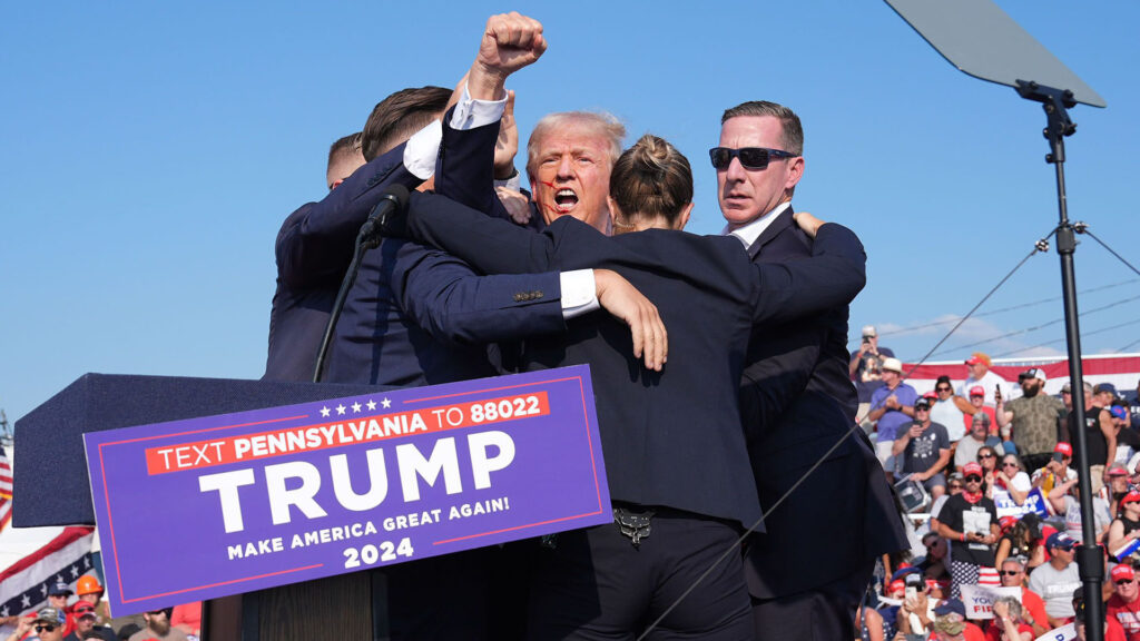 Secret Service members help former president Donald Trump off stage Saturday in Butler, Pa.