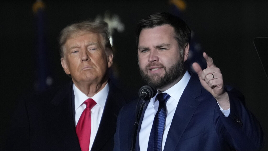 Ohio Senate candidate JD Vance speaks as former President Donald Trump listens at a campaign rally at Wright Bros. Aero Inc. at Dayton International Airport on Monday, Nov. 7, 2022, in Vandalia, Ohio. (AP Photo/Michael Conroy)(Michael Conroy | AP)