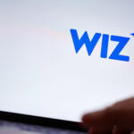 Close-up of the Wiz logo on a computer screen, representing the cloud security platform.