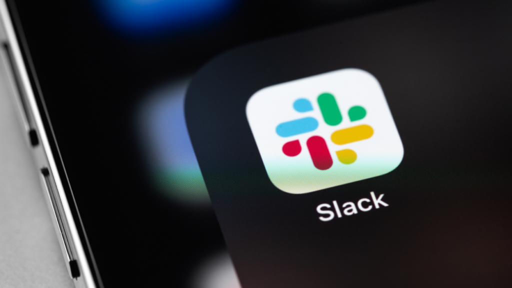 Close-up view of the Slack app icon on a mobile phone screen, showcasing the multicolored logo of the popular workplace communication tool.