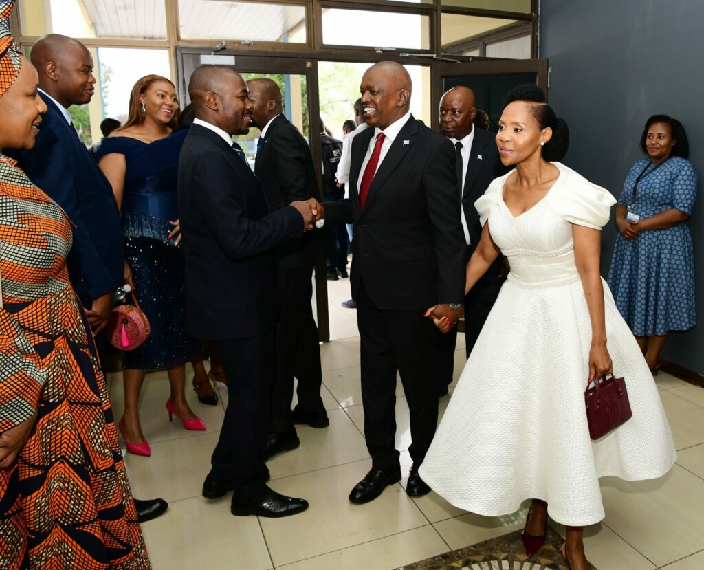 Former president mokgweetsi masisi and first lady neo masisi holding hands and greeting attendees at duma bokos inauguration ceremony