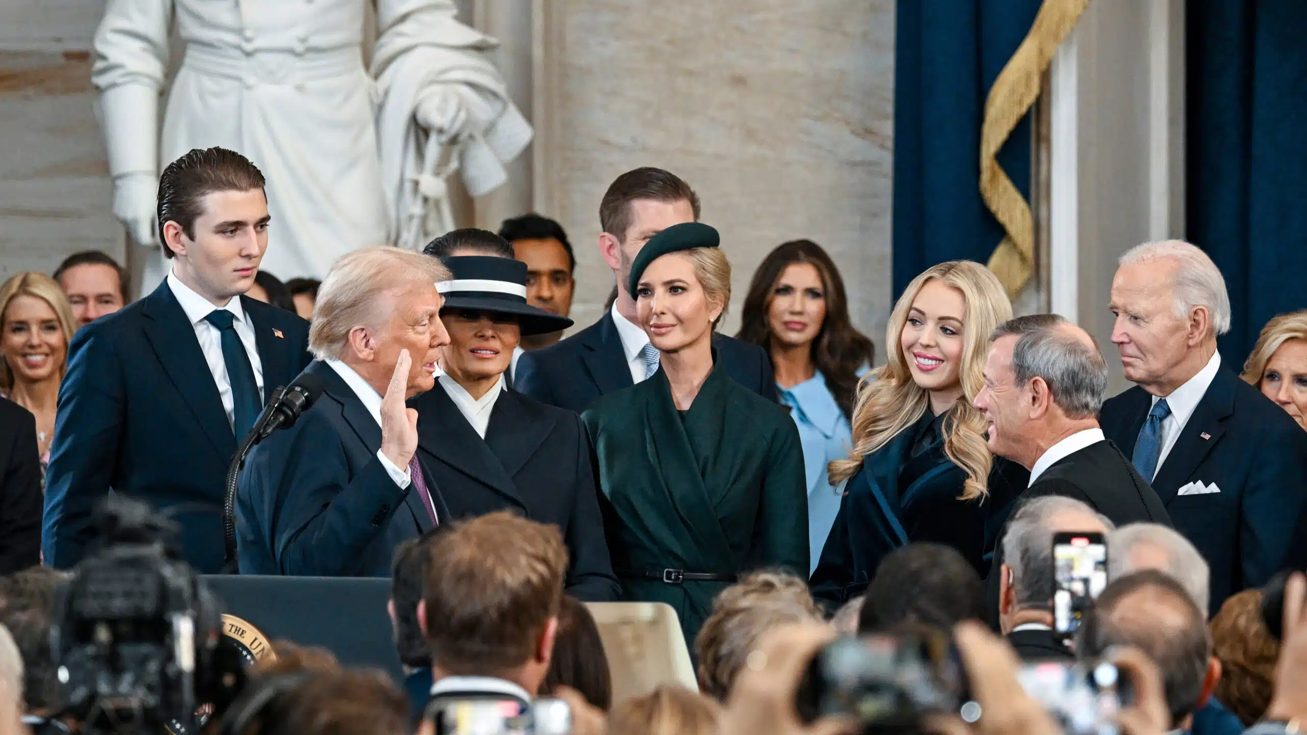 Donald Trump is sworn in as the 47th President of the United States, surrounded by his family, as Chief Justice John Roberts administers the oath during the inauguration ceremony.