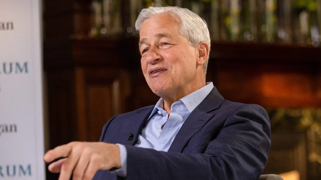 Jamie Dimon Discusses Global Banking and Economic Outlook | Brimco Jamie dimon speaking during an interview seated in a chair and gesturing while discussing economic and financial topics
